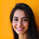 Headshot of Amina Khan, a bright and happy young professional.