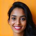 Headshot of Priya S., a client who improved her networking skills.