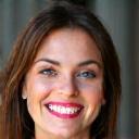 Headshot of Sarah L., a happy and confident client.